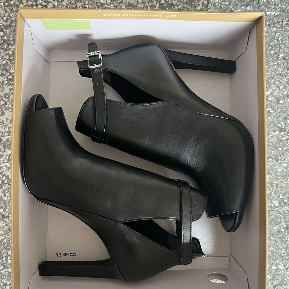 Black leather  boots open toe.
Michael Kors 
New !!
Size 10